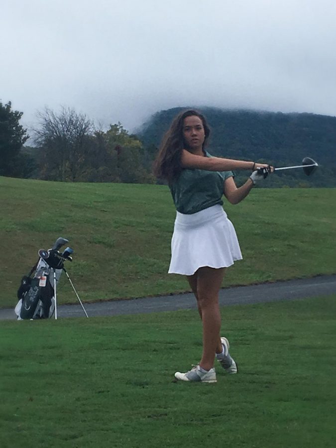 Taking+a+nice+swing+Claire+sends+the+ball+towards+the+hole.+Photo+Credit%3A+Maricris+Alfree