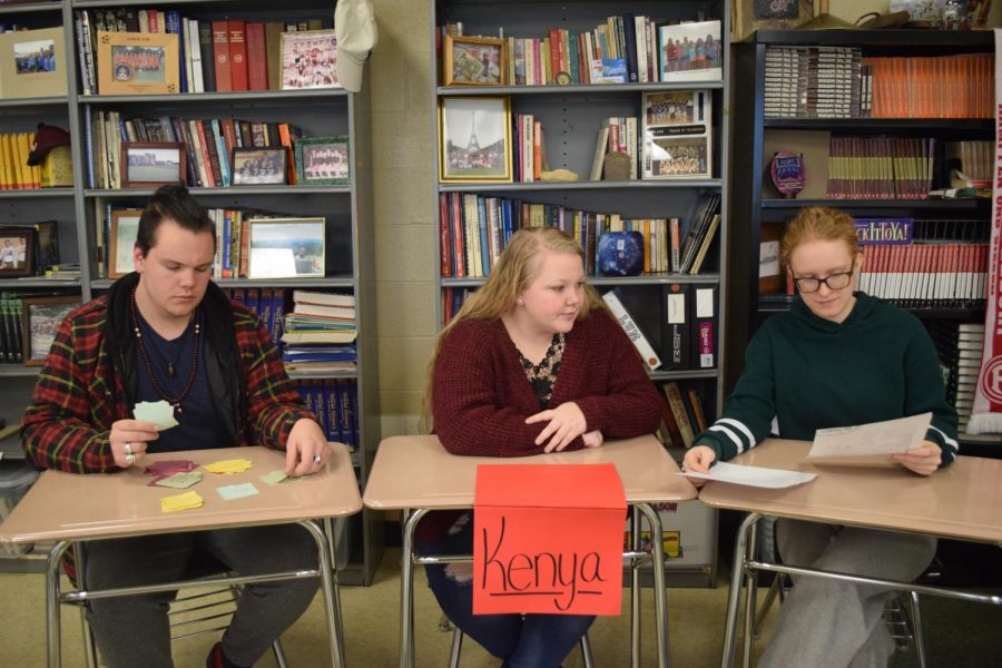In Mr. Lums Economics class, Dakota Blair (12), Sierra Suffecool (12), and Sarah Hoffeditz (12) are working together to plan their next purchase.