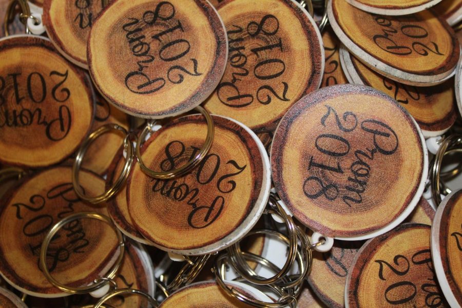 This years Prom tickets are rubber keychains that look like wood to represent the Enchanted Gardens theme. 