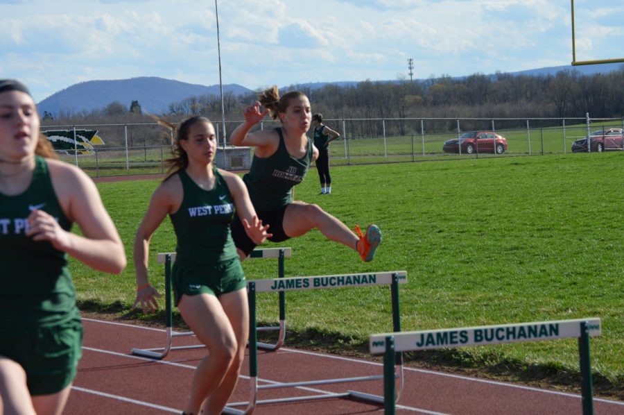 Emily Newman (12), completes her first hurdle of the race.