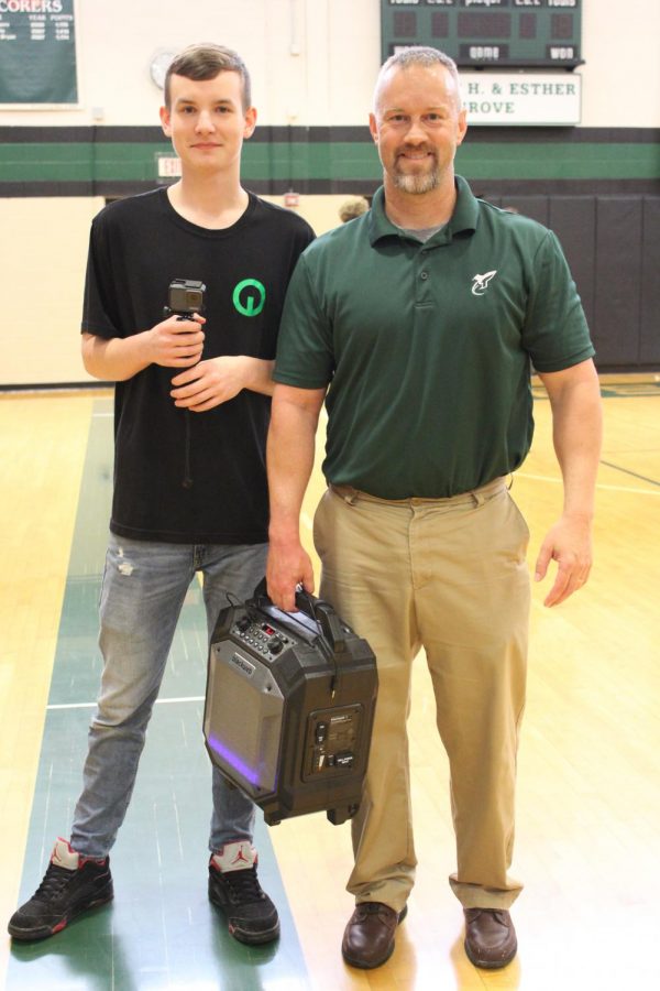 Austin Thomas (10) and Mr. Kevin Gustafson (Faculty) pose for a photo after the third run of the Lip Dub Project on Tuesday.  Austin was behind the camera and Mr. Gustafson had a speaker to play the music.