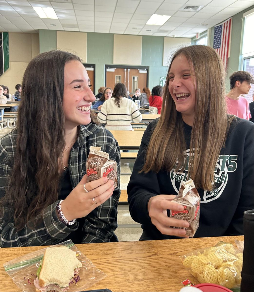 Cafeteria Delicacy
Sharing a laugh over lunch, Lilly Garbinski (10) and Ainsley Green (10) enjoy their chocolate milk out of a Galliker’s-made carton; a sought-after luxury during the milk carton shortage.
