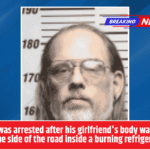 A man was arrested after his girlfriend's body was found on the side of the road inside a burning refrigerator